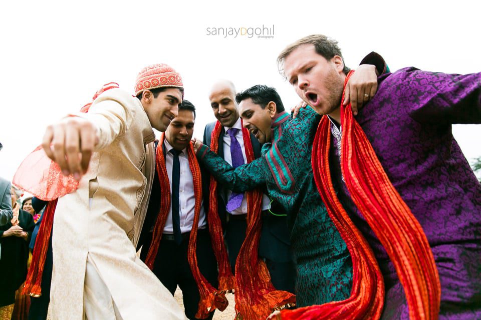 Wedding groom and friends dancing