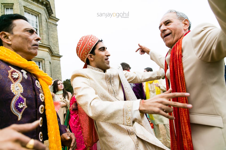 Groom dancing with father