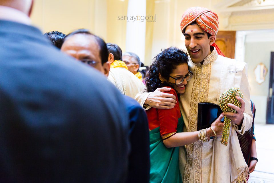 Asian Wedding groom smiling indside hedsor house