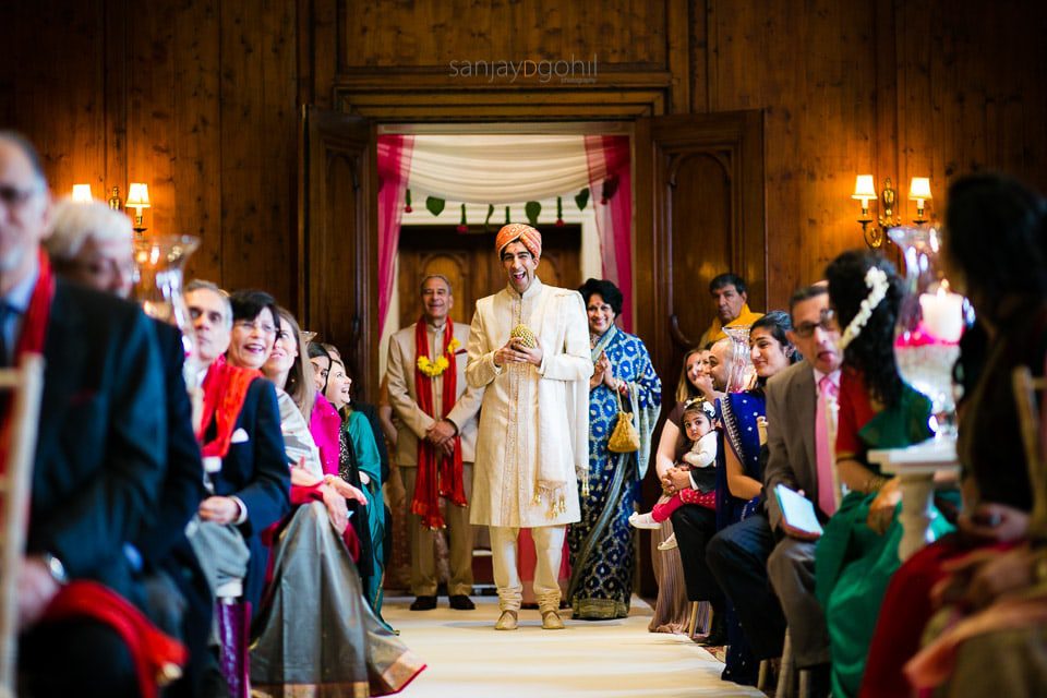 Groom walking to mandap