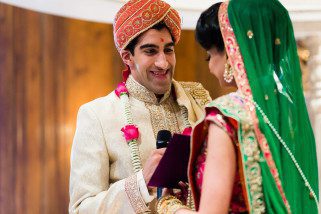 Groom smiling at bride