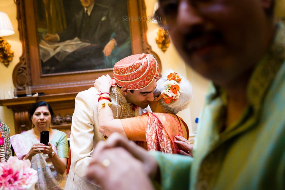 Groom hugging aunt