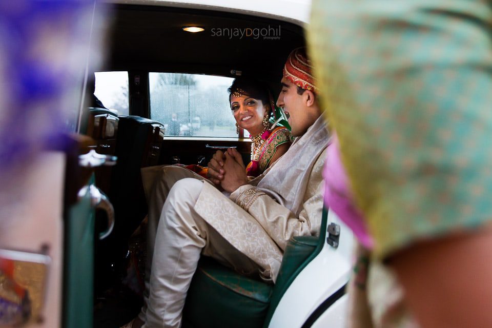 Bride and groom in the wedding car