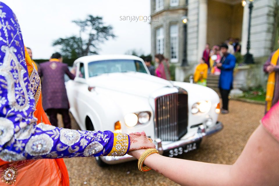 Bride's sisters stopping car from leaving