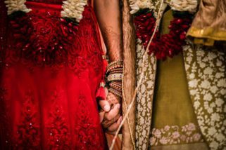 Bride and groom holding hands