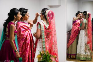 Sisters wiping bride's tears