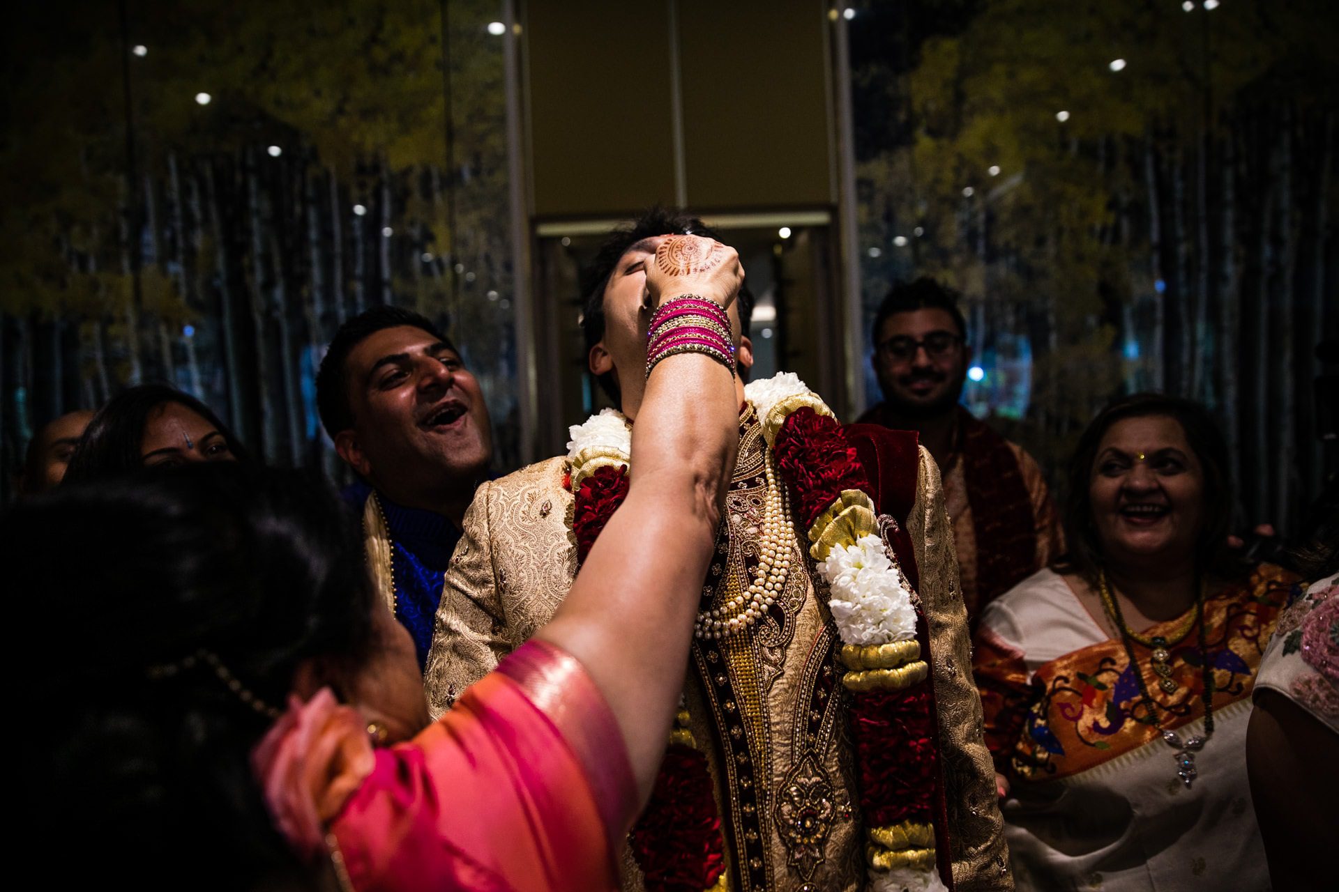 Groom having his nose pinched