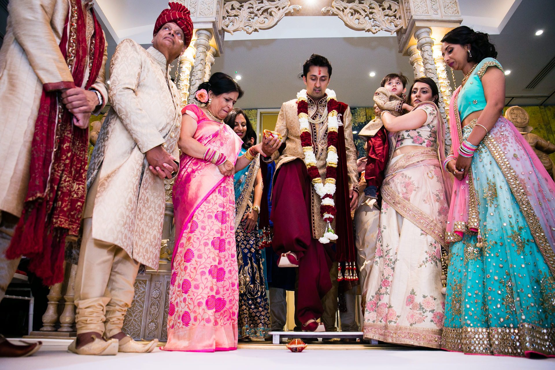 Groom stepping on the clay pot