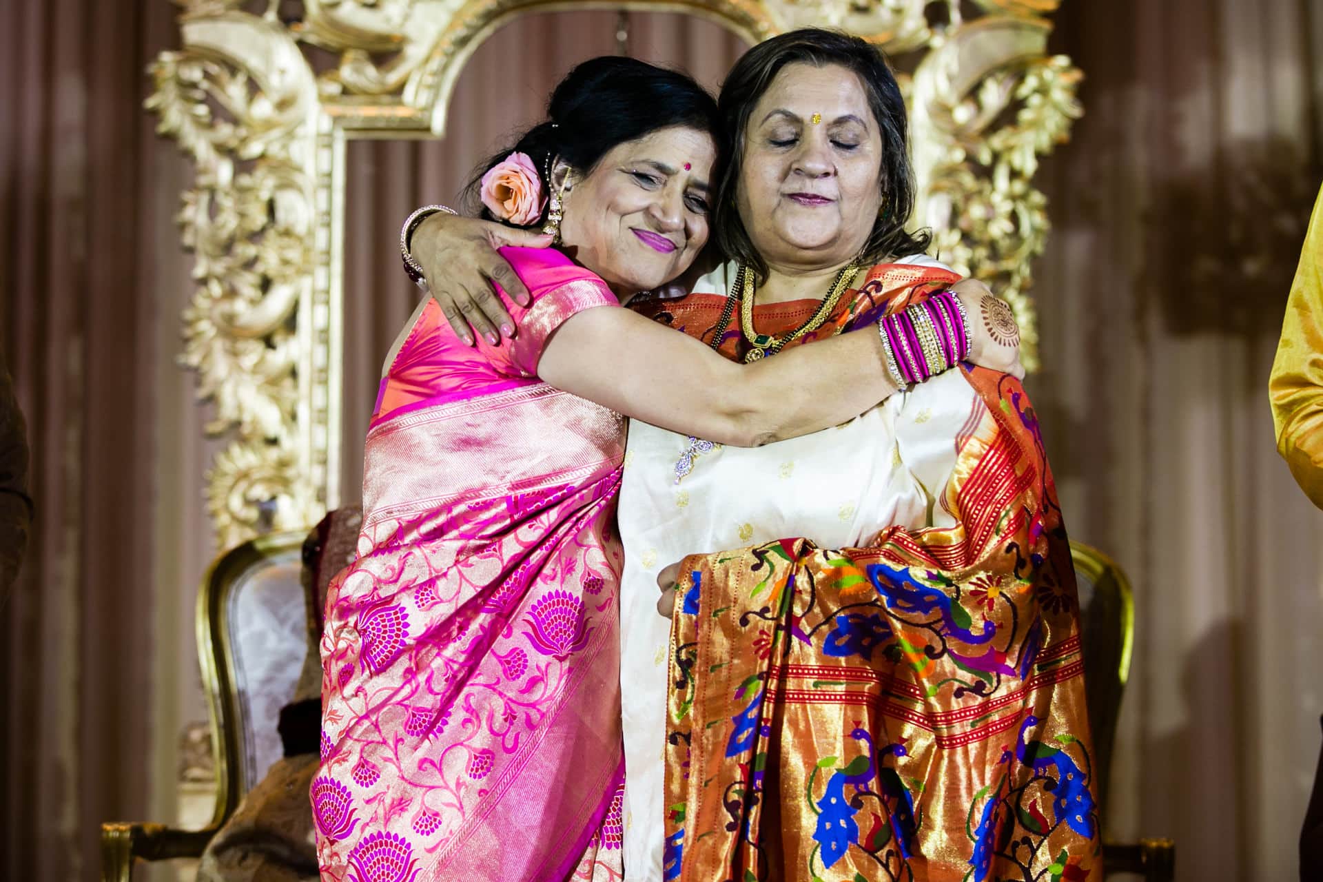 Bride and Groom's mothers hugging