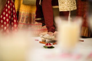 Groom stepping on clay pot