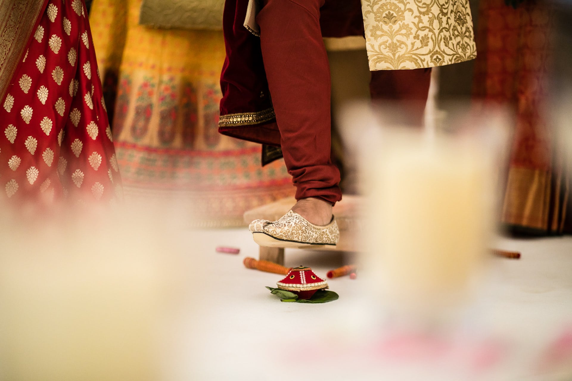 Groom stepping on clay pot