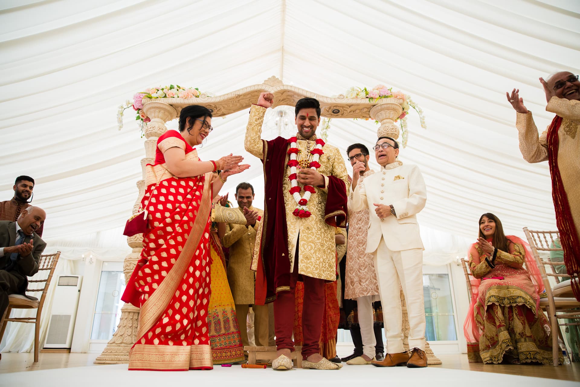 Groom stepping on clay pot