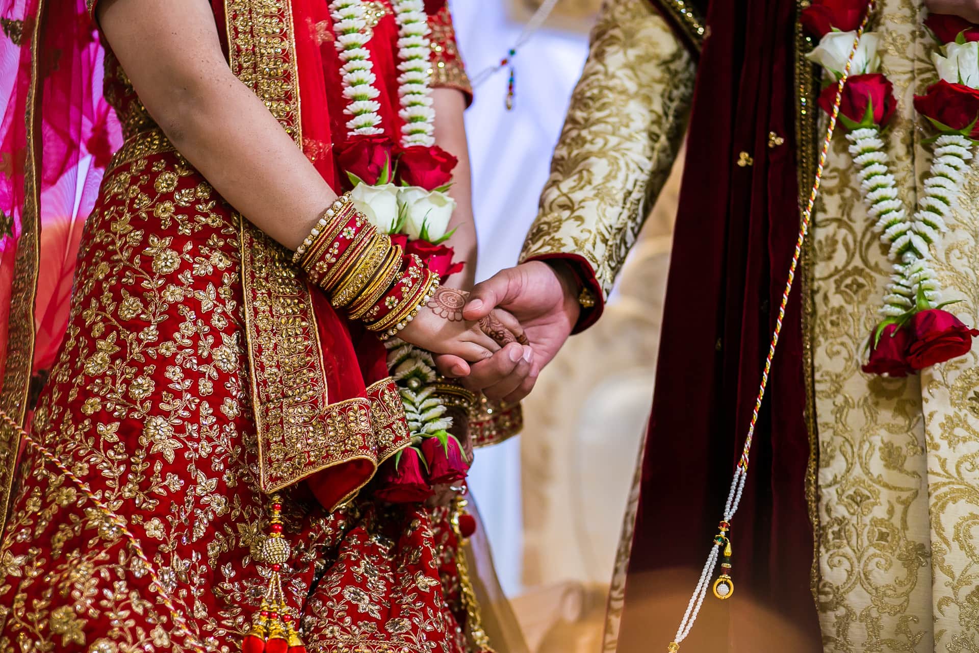 Bride and Groom holding hands