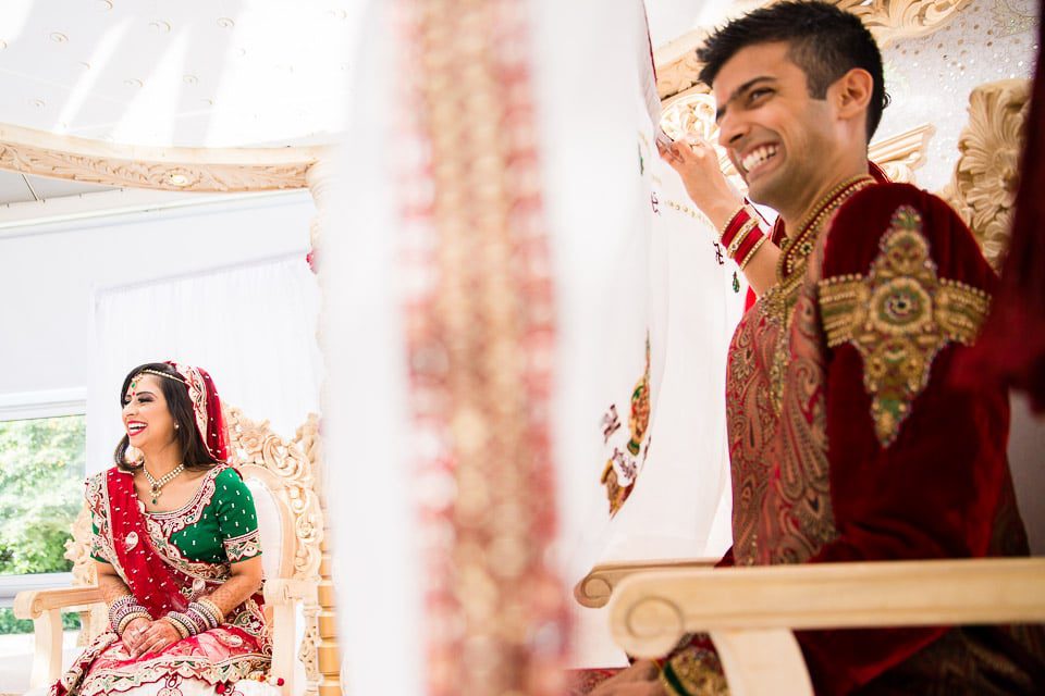 Bride and groom laughing being the antaphat