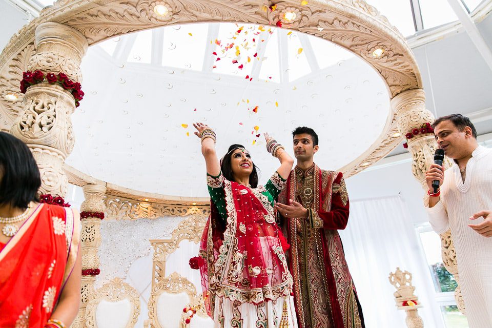 Bride throwing flowers above her head