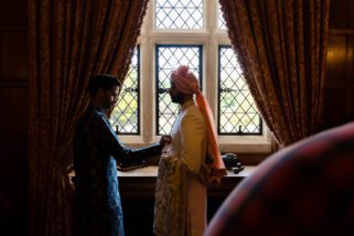 Asian groom getting ready
