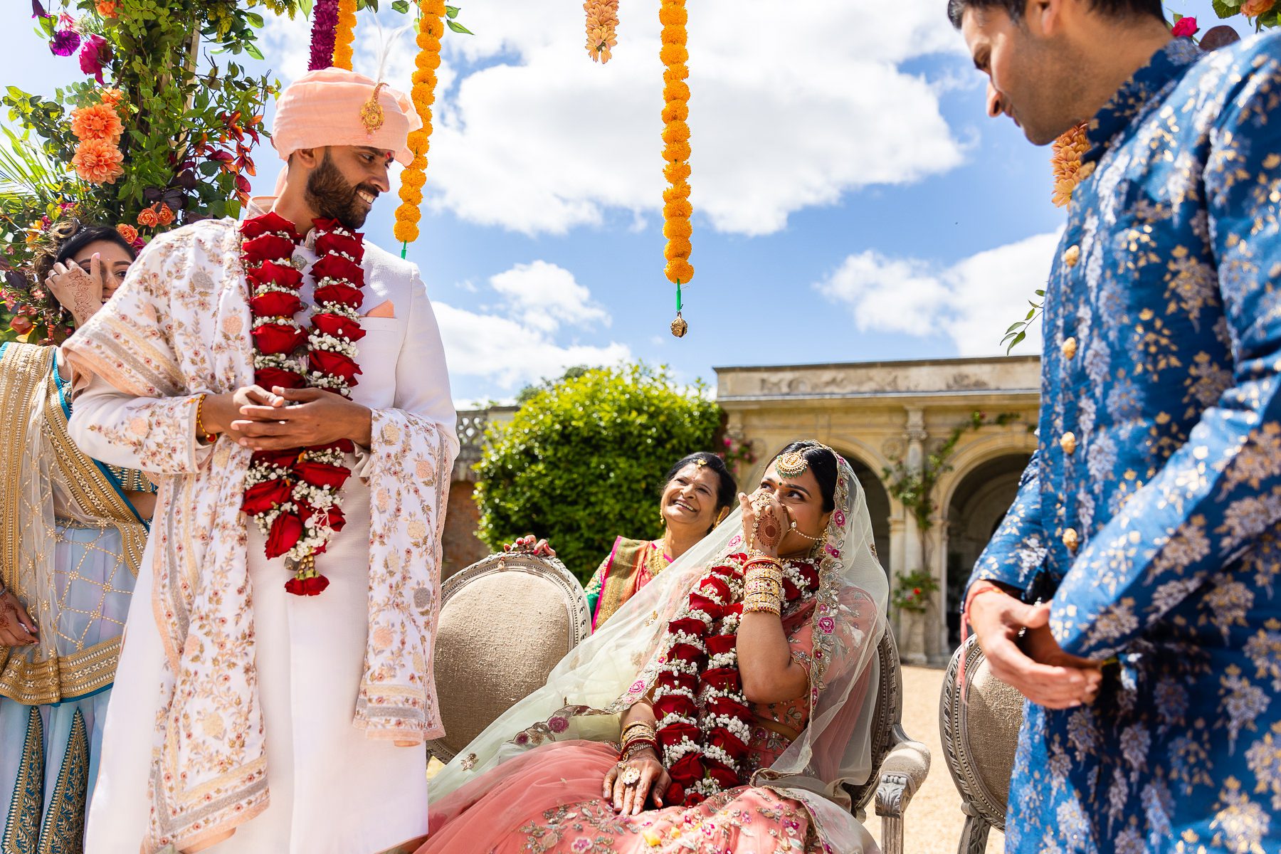 Hindu wedding bride laughing at groom