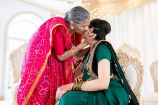 Grandmother kissing bride
