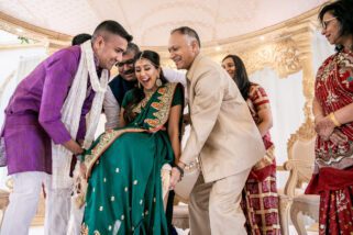 Bride being lifted during Mandvho