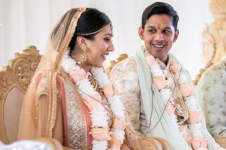 Hindu Groom looking at bride smiling