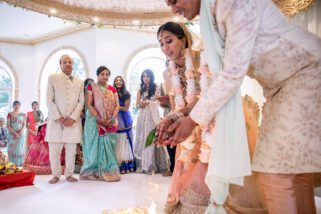 Bride and groom feeding fire