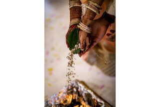 Bride and groom feeding fire