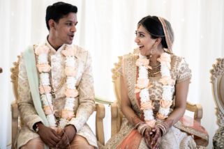 Bride and groom smiling at each other