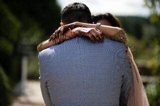 Bride and groom hugging