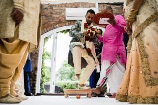 Groom stepping on clay pot