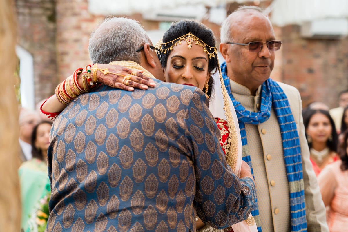 Bride hugging her uncles