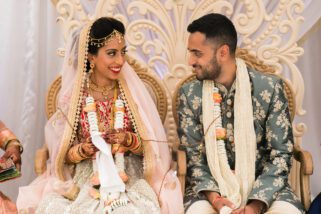 Bride and groom smiling at each other