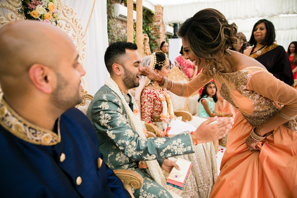 Groom's nose being pinched