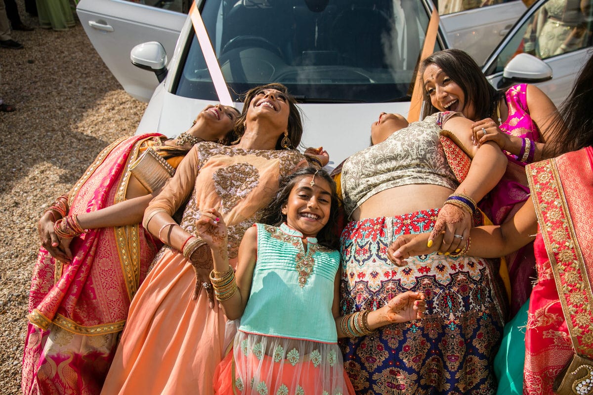 Brides' sister lying on the car