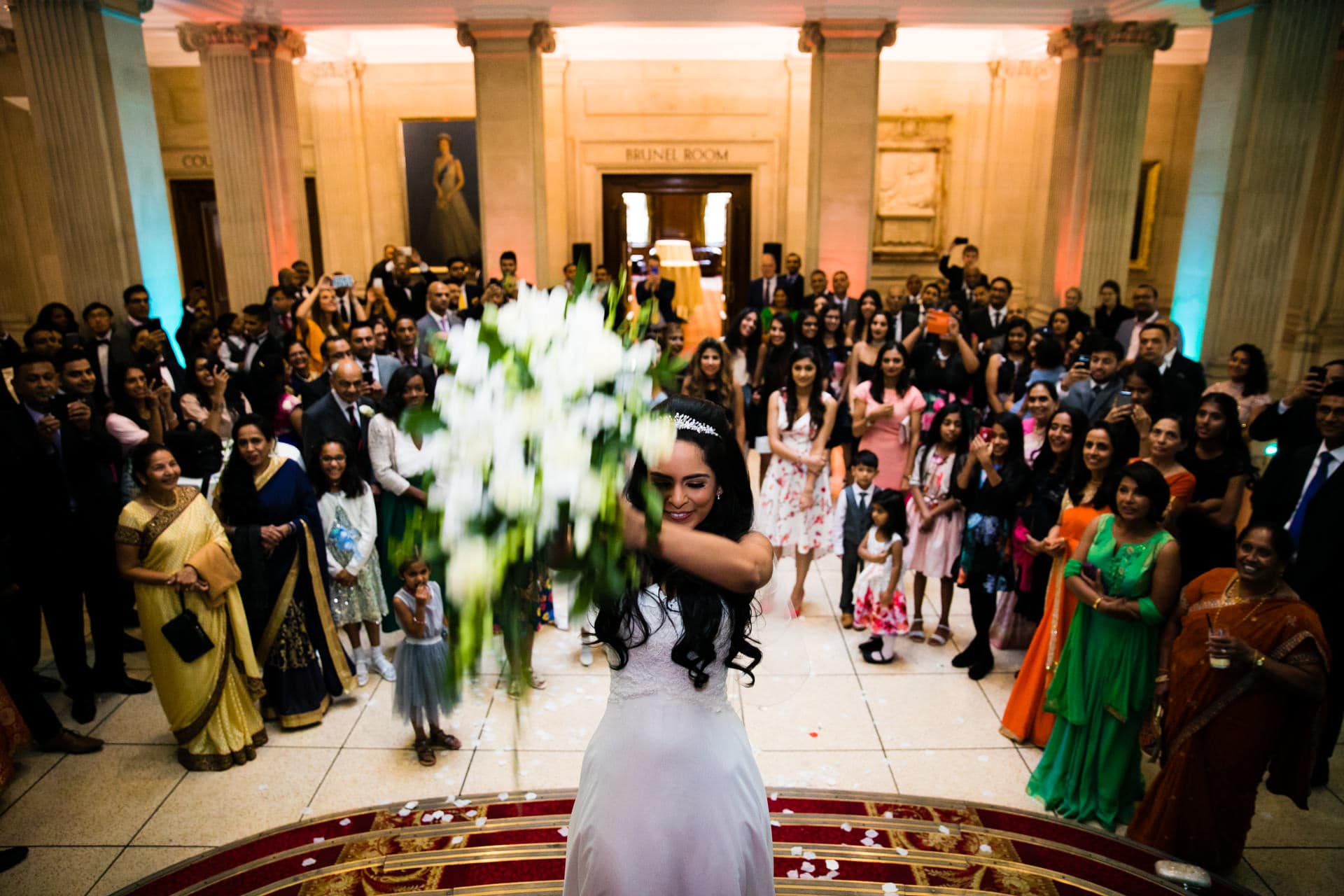Bride throwing her bouquet