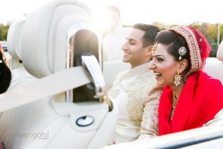 Bride laughing in the car