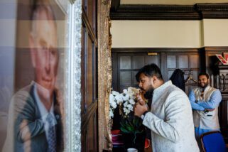 Asian groom getting ready