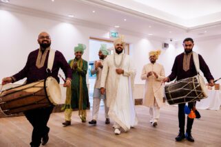 Hindu wedding groom arriving at Oshwal centre