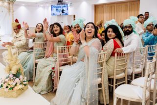 Wedding guests cheering