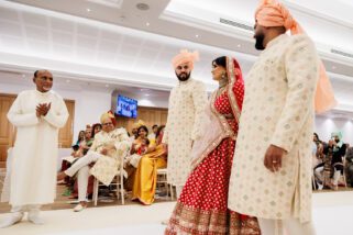 Asian bride arriving at Hindu wedding