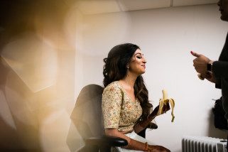 Bride eating while getting ready