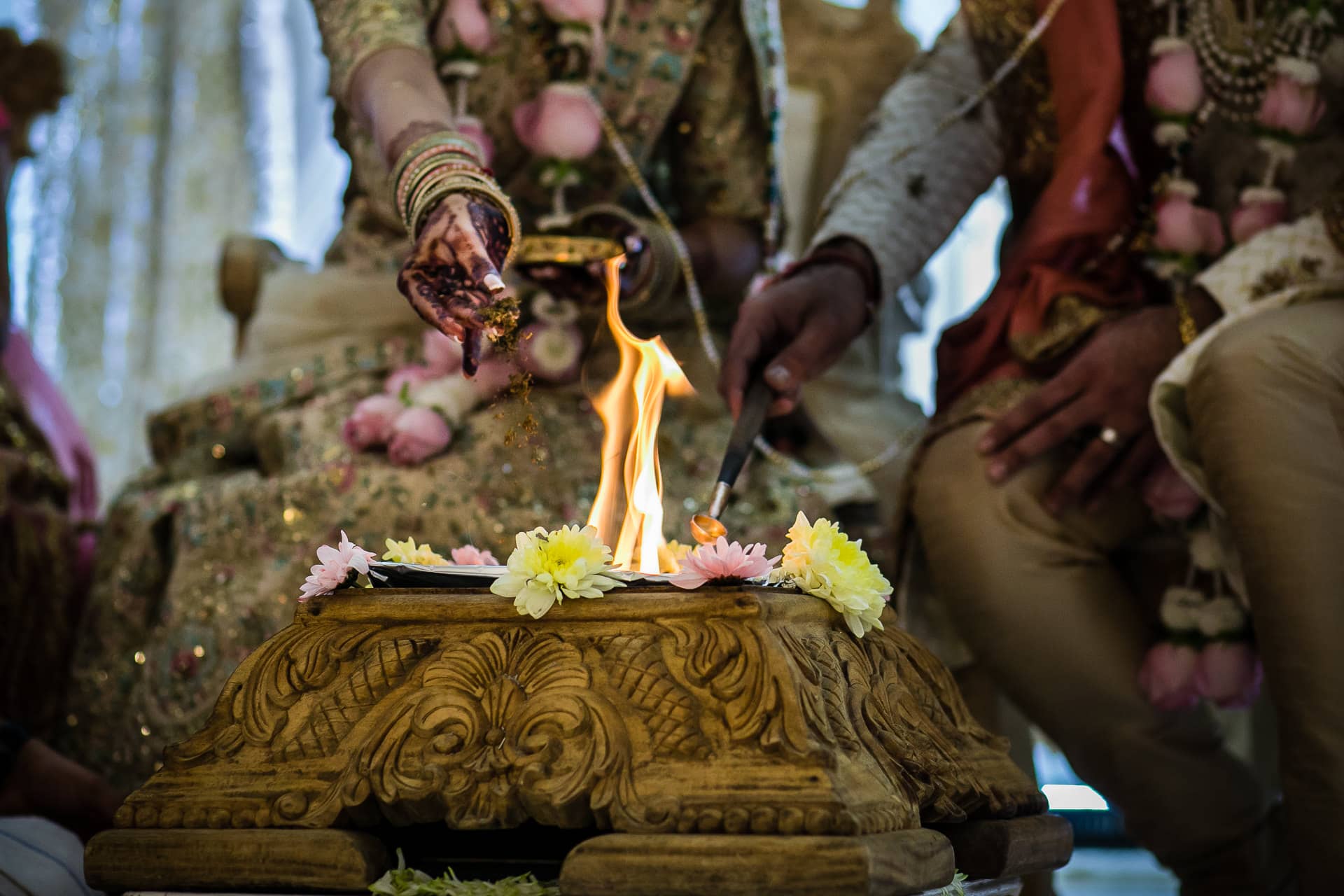 Seeds being poured into the fire during wedding ceremony