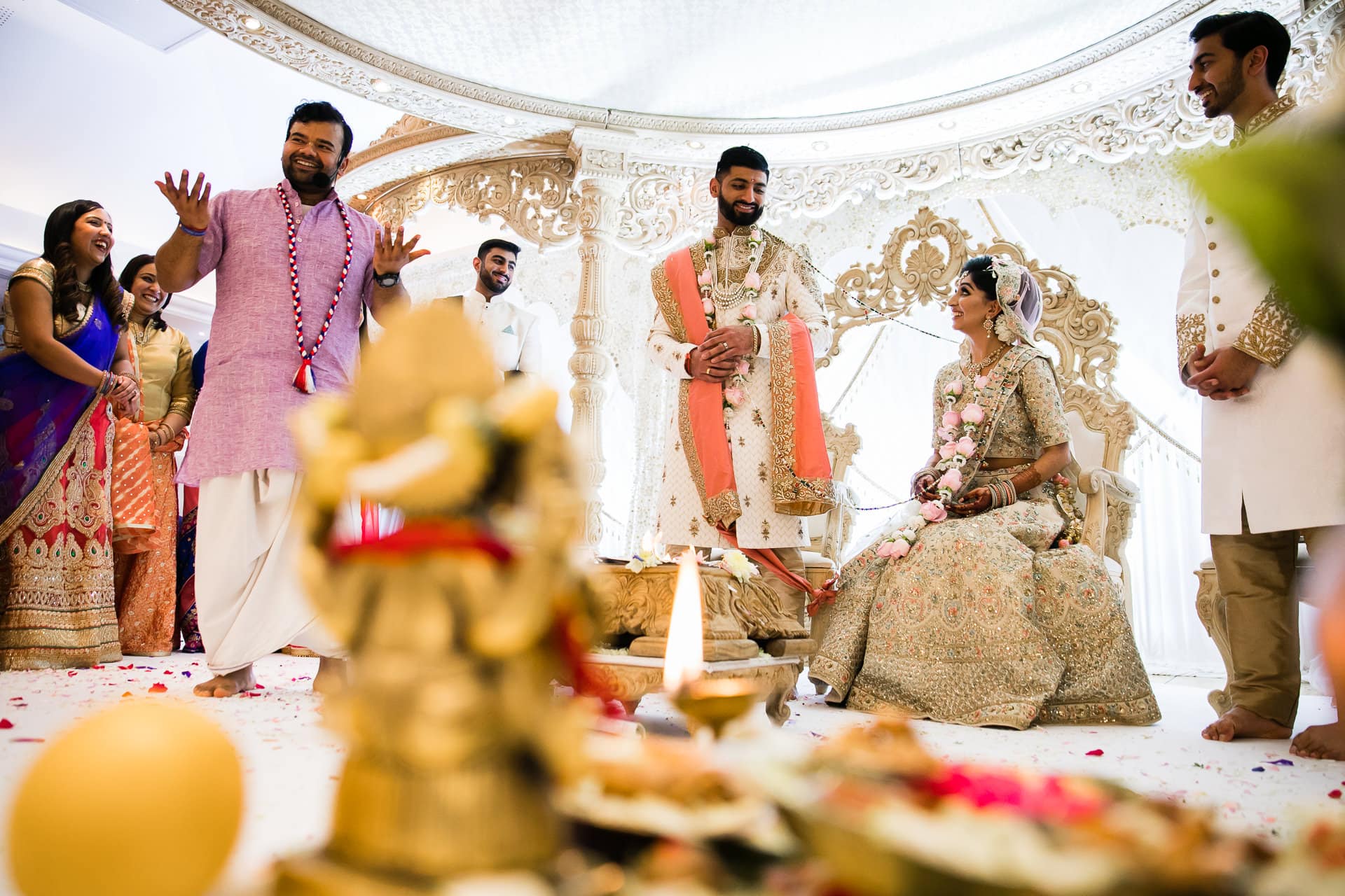 Bride sits down before groom