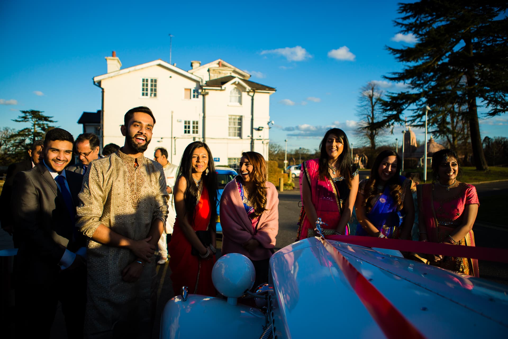 Bride's family stopping the car from leaving 