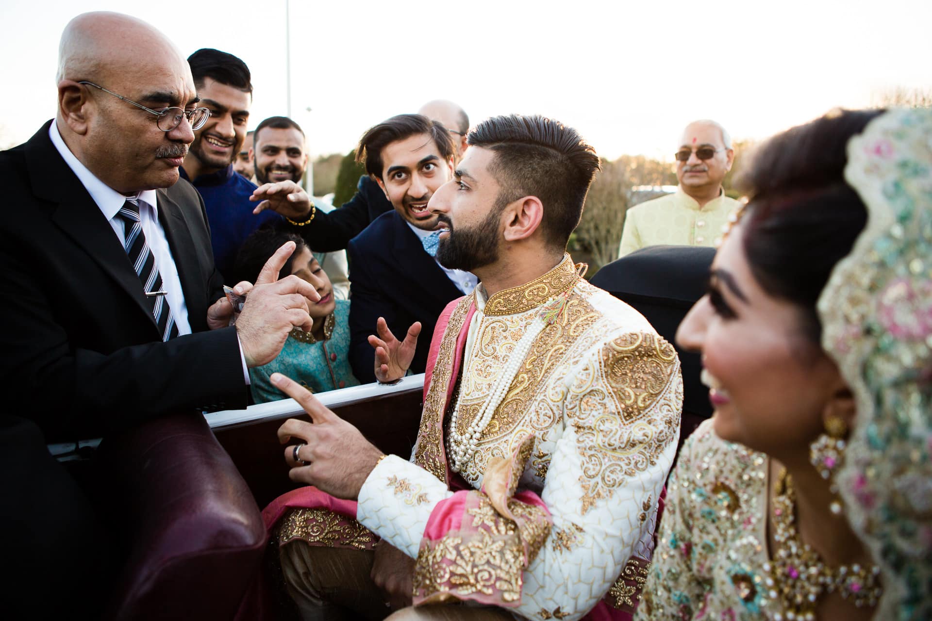 Bride's family stopping the car from leaving 