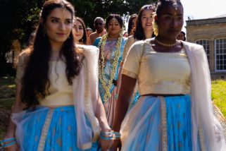 Hindu bridal arrival with bridesmaids