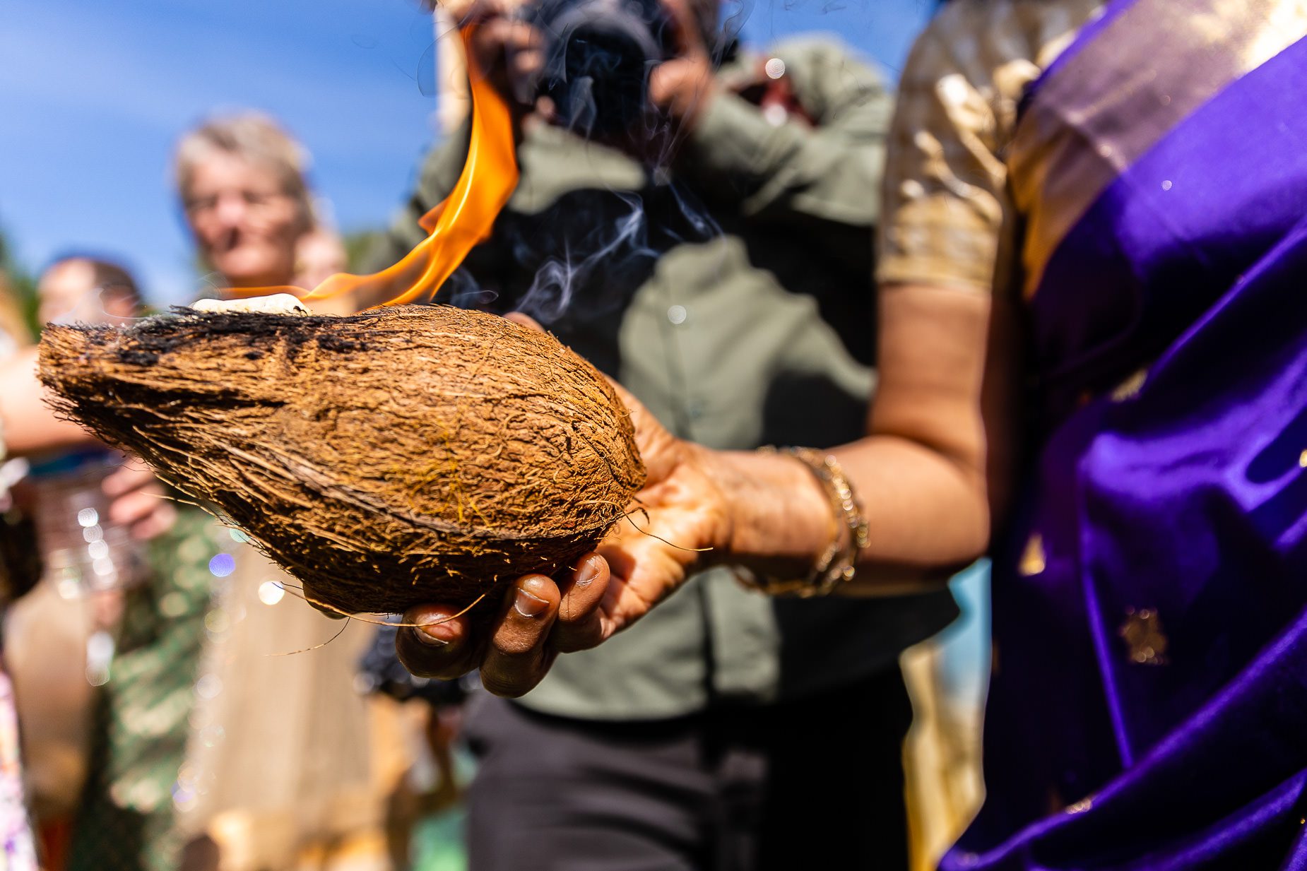 Coconut with flame during wedding blessing