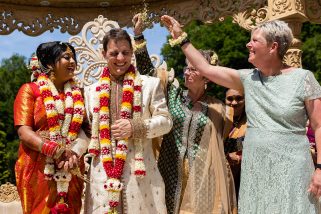 Bride and groom being showered with flowers