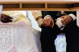 Bride and groom holding hands
