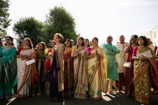 Asian wedding guests arriving for wedding ceremony