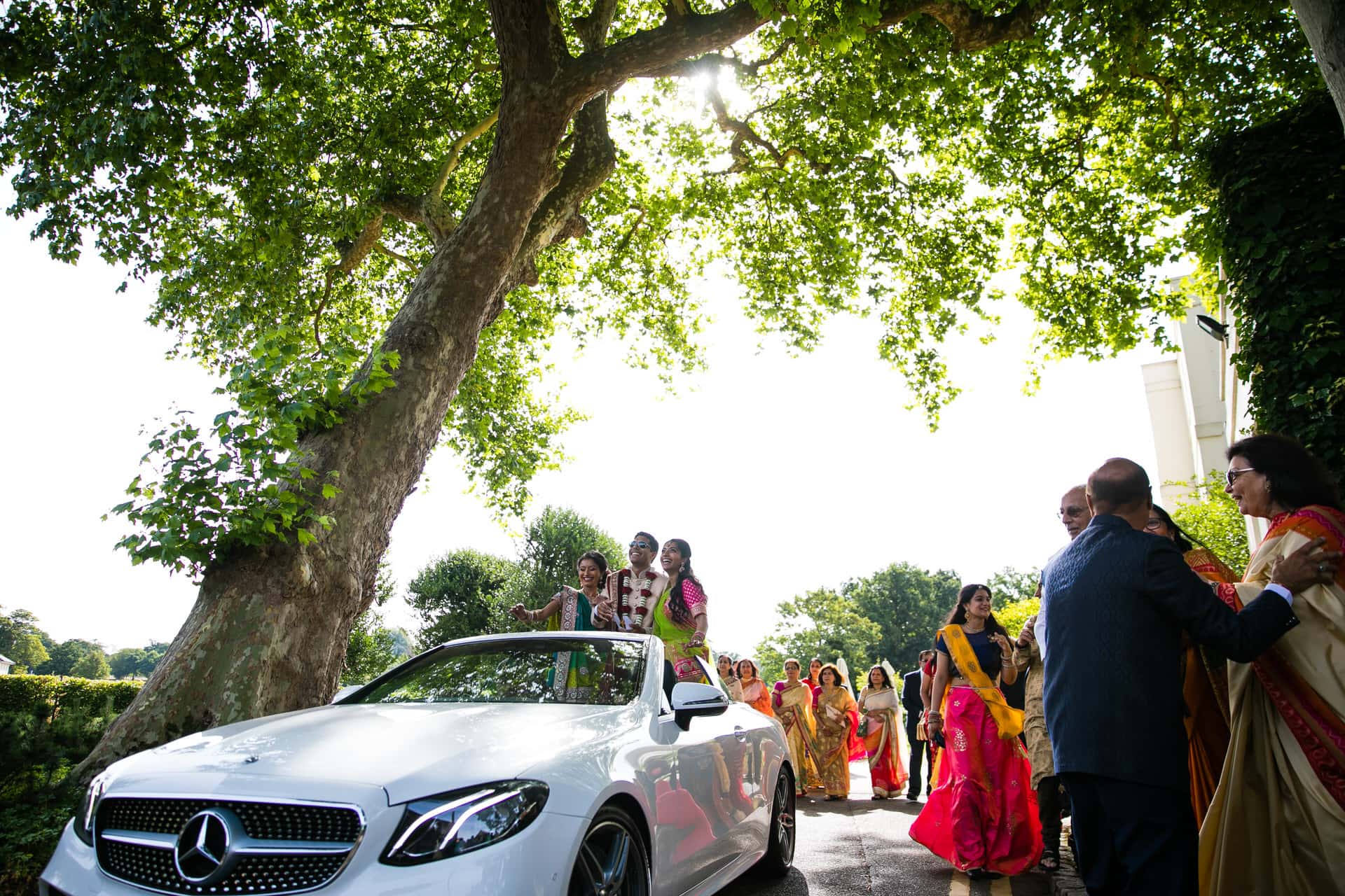 Asian wedding guests arriving for wedding ceremony